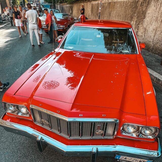 Yesterday we visited an exhibition of vintage American cars in Ariccia 🇺🇸

And we found ourselves in front of Starsky&Hutch's Ford #GranTorino 😍
Not the original one from the TV show, but an identical model used by the actors when they came to #Italy for some filming (as guests on a #TV show if I got it right). The funny thing is that when they returned it to the owner, he found their autographs on the dashboard 😁 

Did you know the history of this famous car, a model that came into being thanks to the TV show, nicknamed "Striped Tomato" by Americans? 

Initially Starsky was supposed to drive a green and white Chevrolet Camaro convertible, but Chevrolet did not have enough cars available, so Aaron Spelling (the producer) turned to Ford, which proposed a contract that saved the production a lot of money but had some limitations: for example, only cars from a particular garage near Los Angeles could be used for the film. So the choice was very narrow, and what's more, two identical cars were needed, which further limited the choice of cars. The manufacturers chose two 1975 Gran Torino cars that mounted the Windsor V8, the latest evolution of the small block engine that had debuted in 1962. The #cars were, however, "too normal." To solve the problem George Grenier, who was in charge of transportation for the shoot and dabbled in design, created the white stripes. That was not enough, however, and to "buff-up" the car they fitted air suspension, oversized rims, and raised the rear end. 
The result pleased the producers but not the actors, who hated it and tried several times to intentionally damage it during filming. 
In contrast, the public loved the car right away, so on February 9, 1976, after receiving numerous requests, #Ford announced a limited production run of 1,000 1976 Starsky&Hutch Gran Torino, color Bright Red with a white vectoring side stripe. 
A total of 1308 models were eventually produced, including three prototypes and those used (and destroyed) for the series. 

🎥🚘

#mesupiontheroad #mesupionlocation #starskyandhutch #classiccars #americancars #oldcars #fordgrantorino #famouscars #celebrity #travel #travelblogger #traveldesign